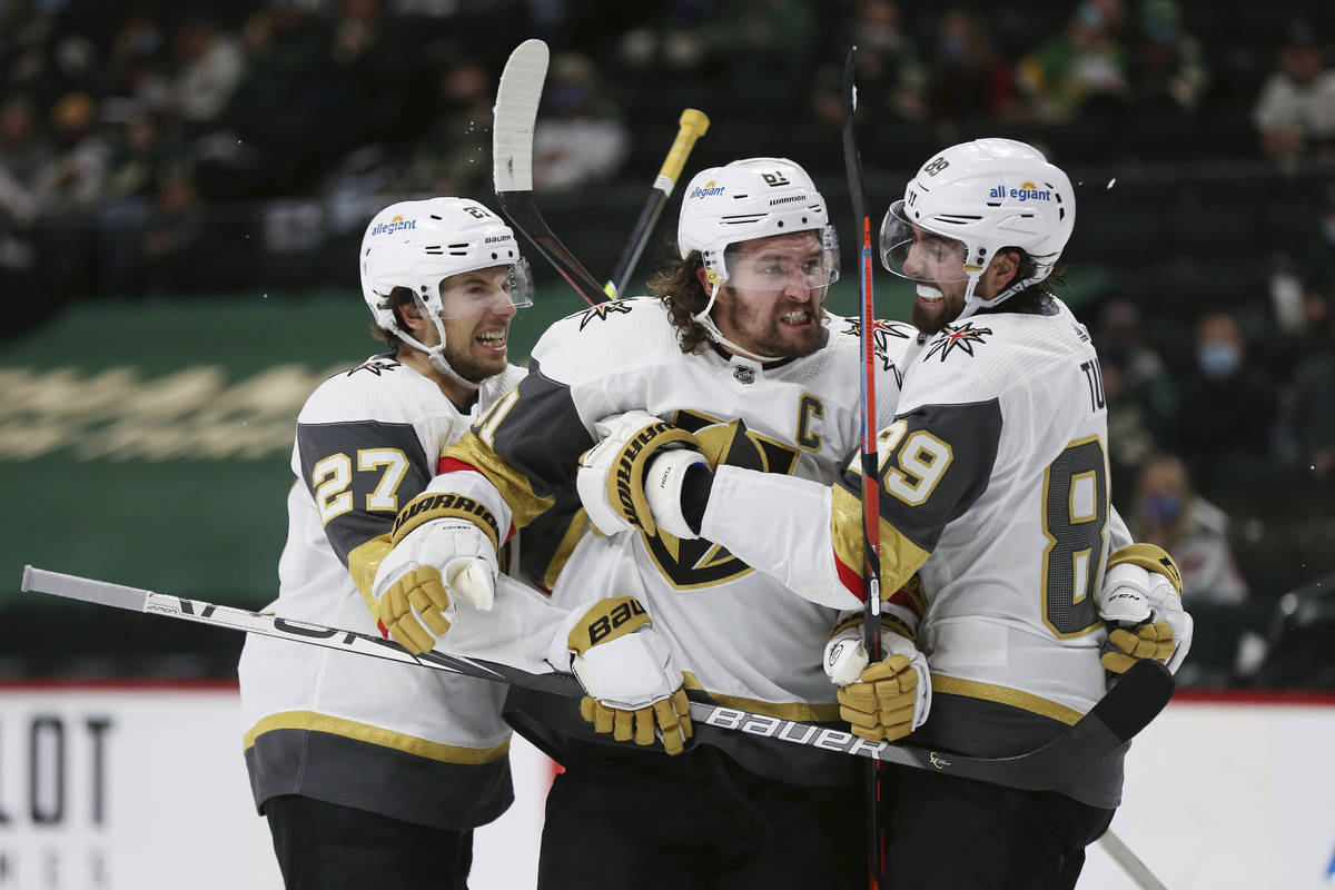 Vegas Golden Knights' Mark Stone (61) celebrates with teammates after scoring a goal against th ...