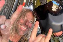 George Null, left, poses with a rescue crew member after he was picked up Wednesday, May 19, 20 ...