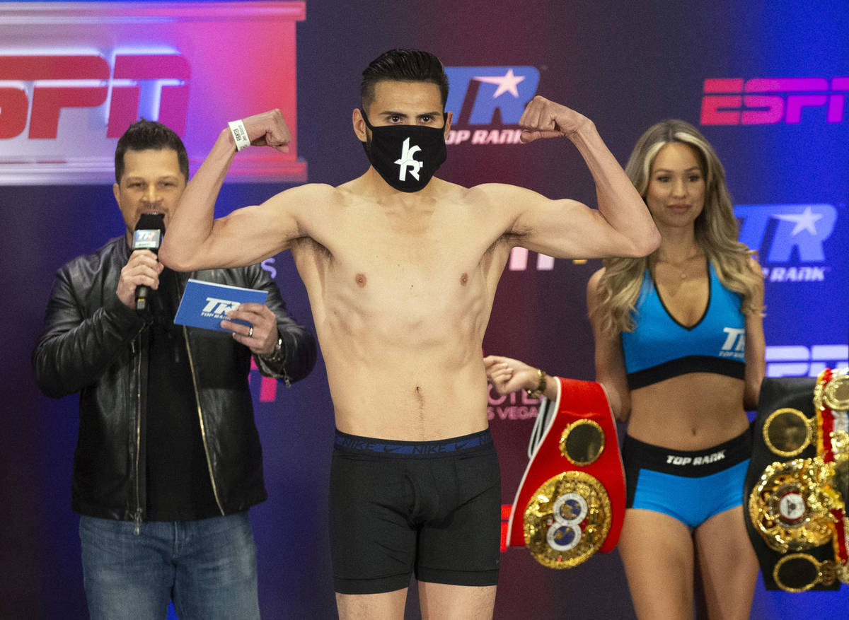 Jose Ramirez poses on the scale during a weigh-in at the Virgin Hotel in Las Vegas, Friday, May ...