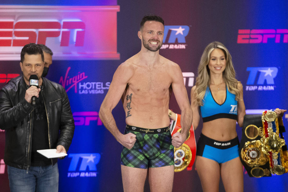 Josh Taylor poses on the scale during a weigh-in at the Virgin Hotel in Las Vegas, Friday, May ...