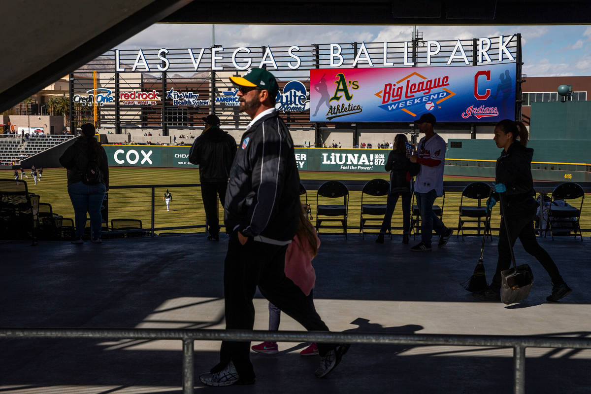 Fans stream about the stadium as the Cleveland Indians and Oakland Athletics play during a Big ...