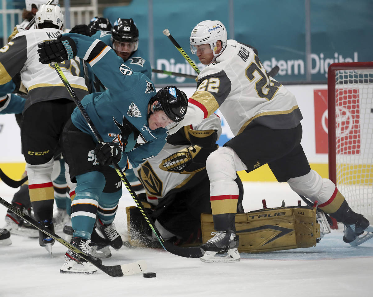 San Jose Sharks center Ryan Donato (16) fights for the puck against Vegas Golden Knights defens ...