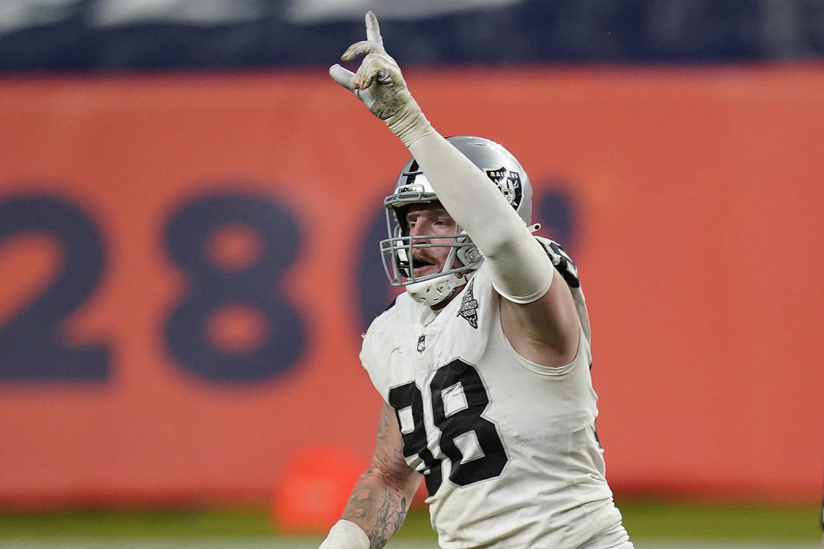 Las Vegas Raiders defensive end Maxx Crosby (98) celebrates after blocking  a field goal attempt …