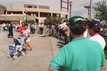 Baseball fans line up to purchase tickets for the Oakland A's opening homestand at Cashman Fiel ...