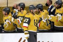 Golden Knights left wing Max Pacioretty (67) and Golden Knights right wing Mark Stone (61) fist ...
