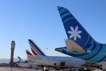 The tails of several international air carriers on Monday, Jan. 6, 2020, as extra flights arriv ...