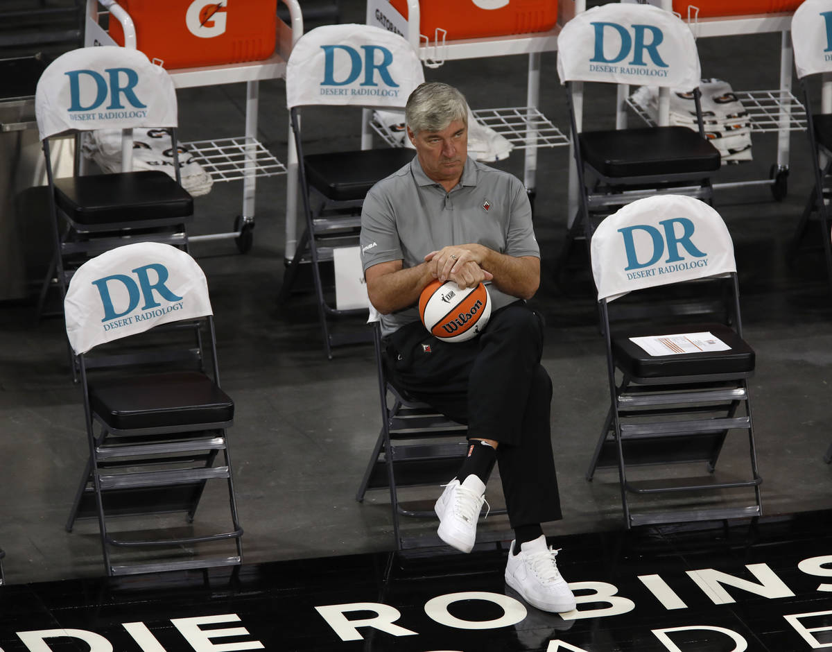 Las Vegas Aces head coach Bill Laimbeer watches his players warming up before a WNBA basketball ...