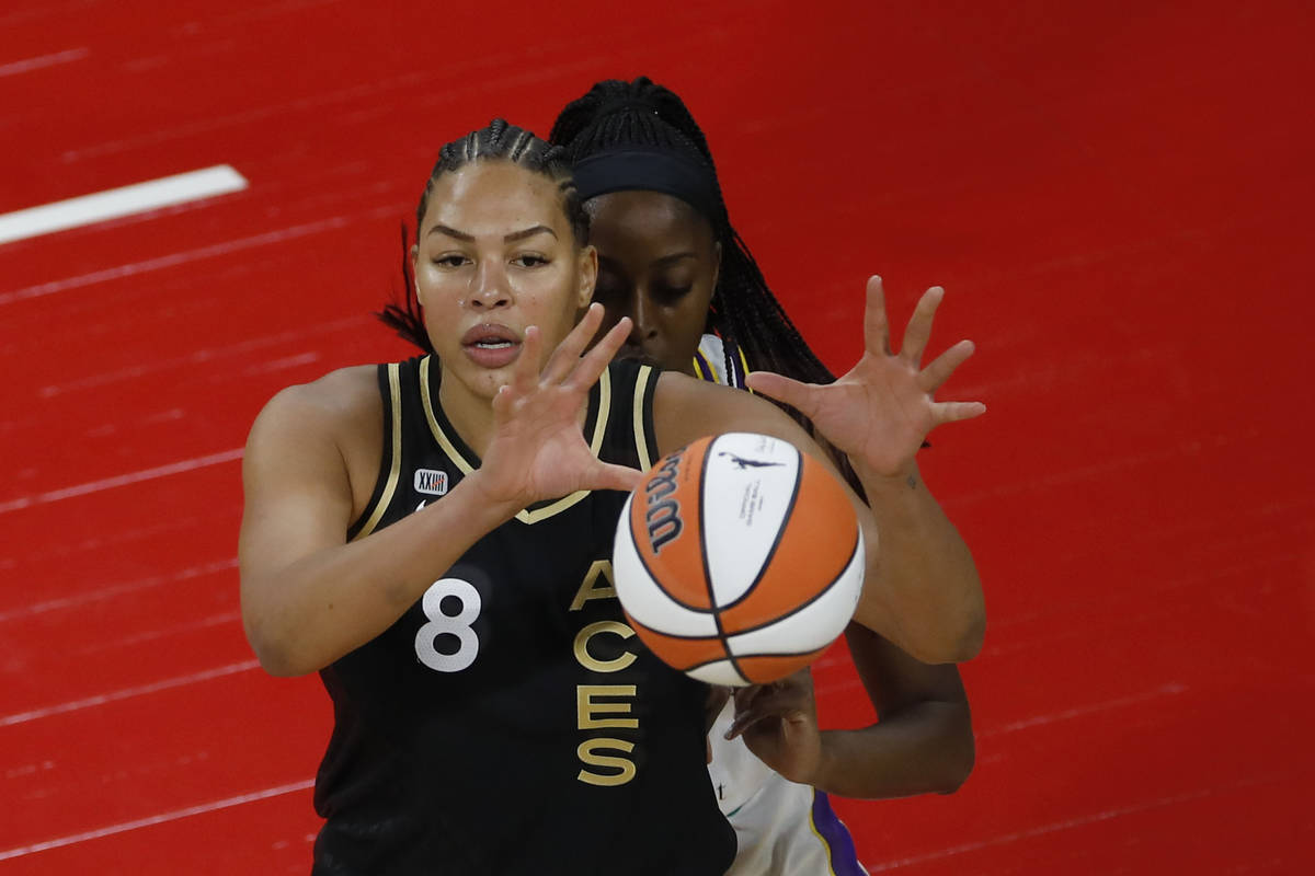 Las Vegas Aces center Liz Cambage (8) receives a ball against Los Angeles Sparks forward/center ...