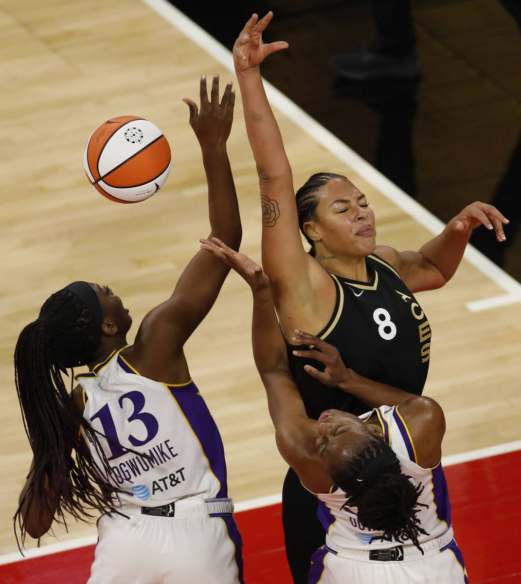 Las Vegas Aces center Liz Cambage (8), Los Angeles Sparks forward/center Chiney Ogwumike (13) a ...
