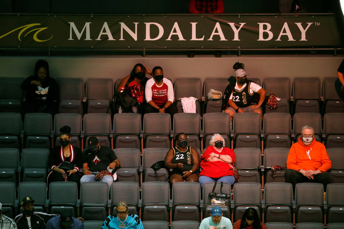 Fans watch the third quarter of a WNBA basketball game in Las Vegas, Friday, May 21, 2021. (Chi ...