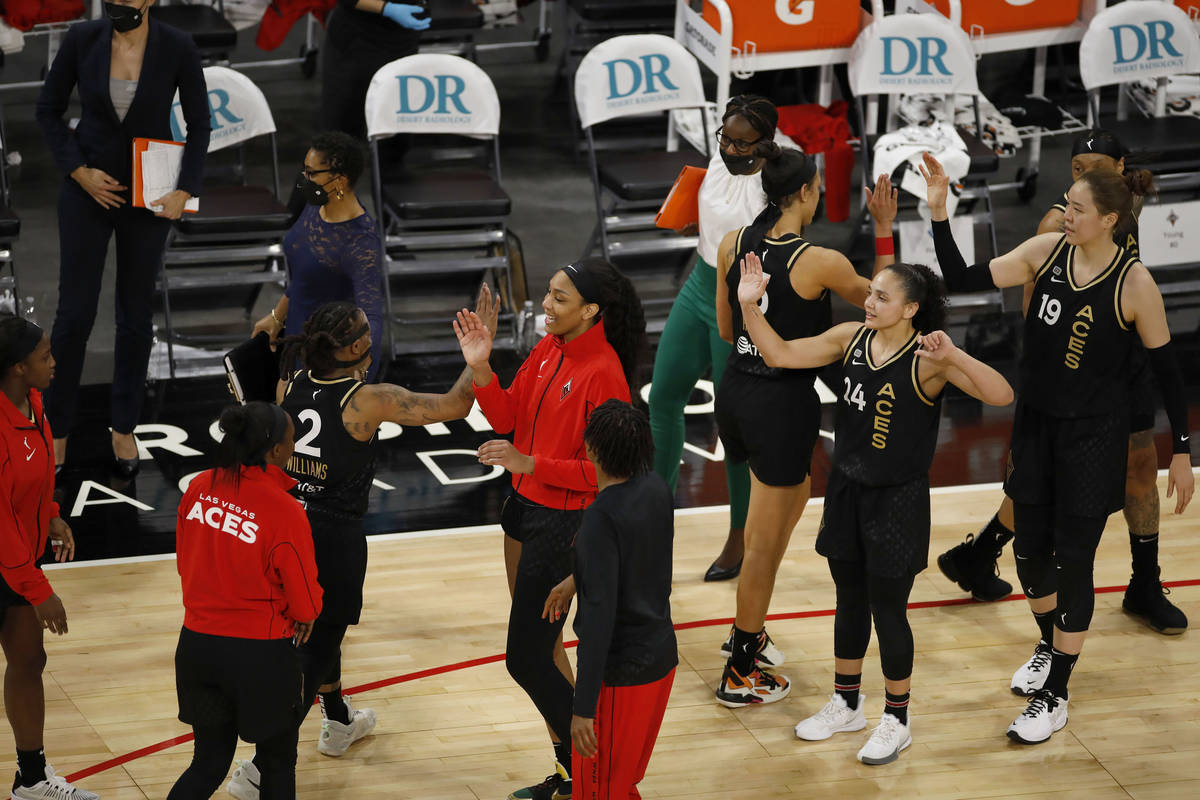 Las Vegas Aces players celebrate their victory against Los Angeles Sparks after a WNBA basketba ...