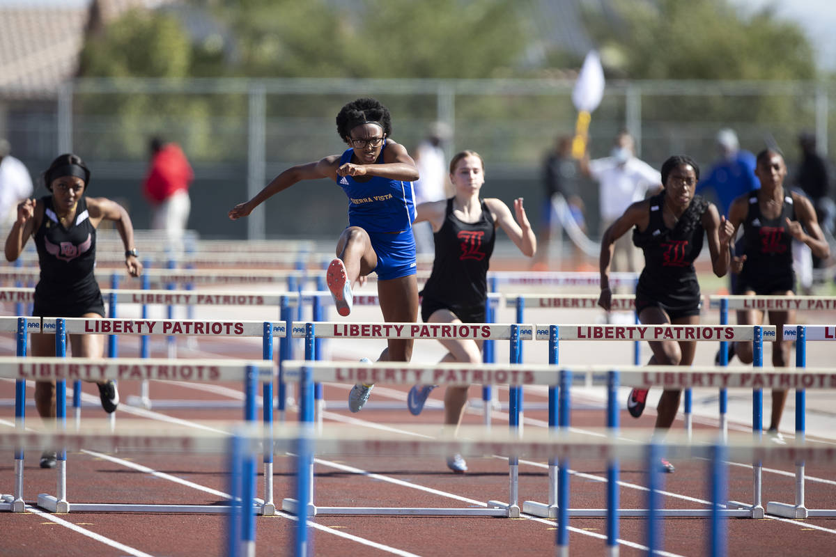 Sierra Vista's Ajanae Cressey, second from left, competes in the girls 100 hurdles final race d ...