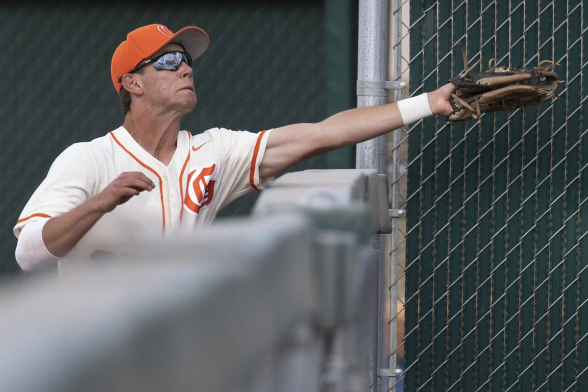 Bishop Gorman High's right fielder Tyler Whitaker catches a foul ball during the Class 5A regio ...