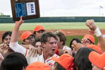 Bishop Gorman High's right fielder Tyler Whitaker joins his teammates as they celebrate their v ...