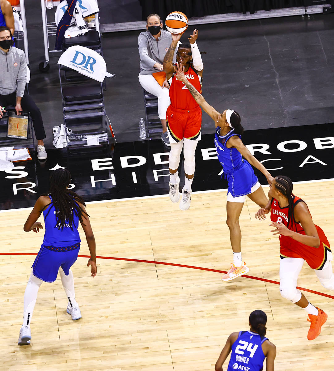 Las Vegas Aces' Riquna Williams (2) shoots under pressure from Connecticut Sun's Jasmine Thomas ...