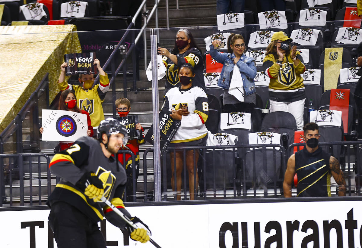 Golden Knights fans cheer as the team warms up for Game 5 of a first-round NHL hockey playoff s ...