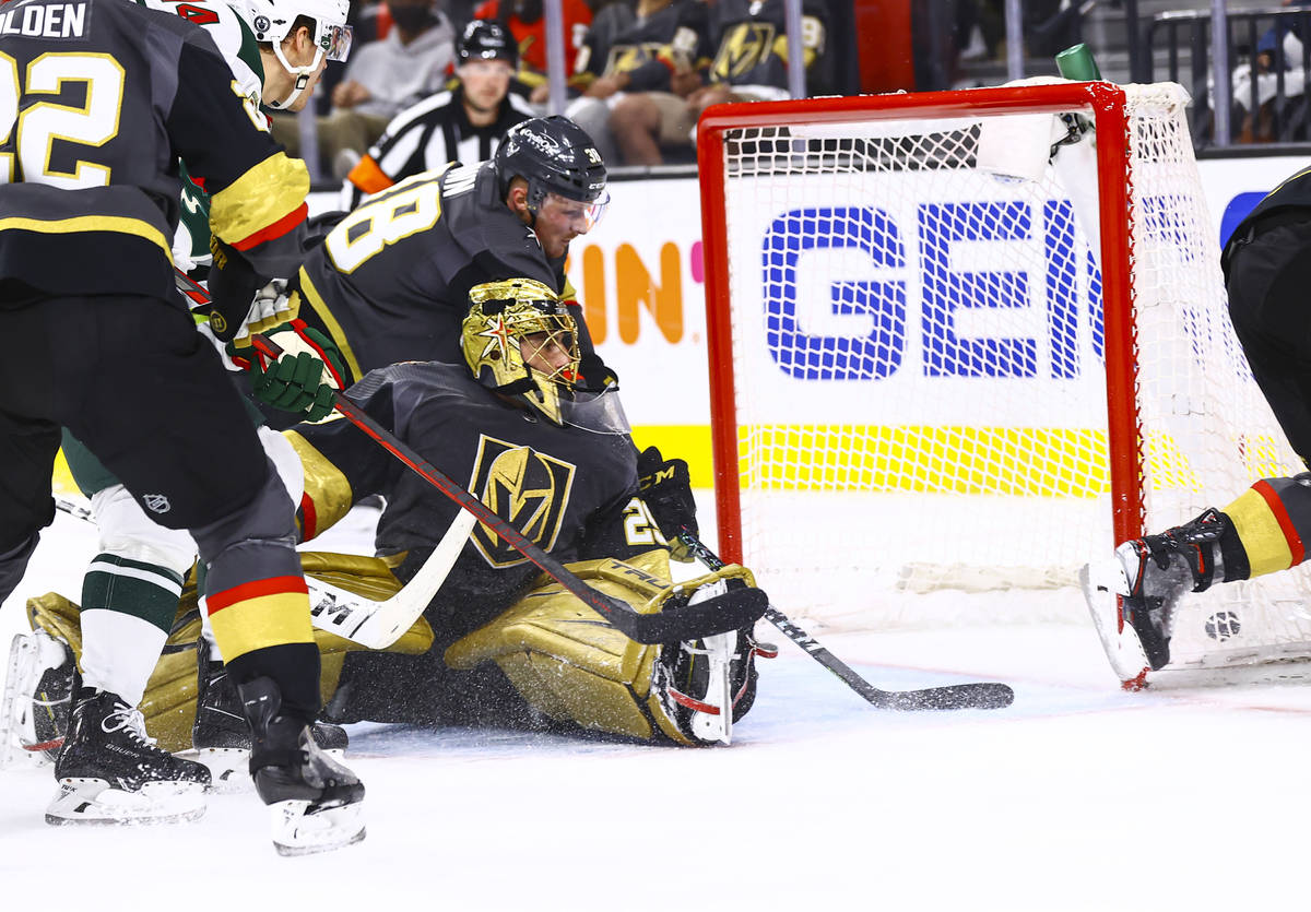 Golden Knights goaltender Marc-Andre Fleury (29) gives up a goal to Minnesota Wild's Jordan Gre ...