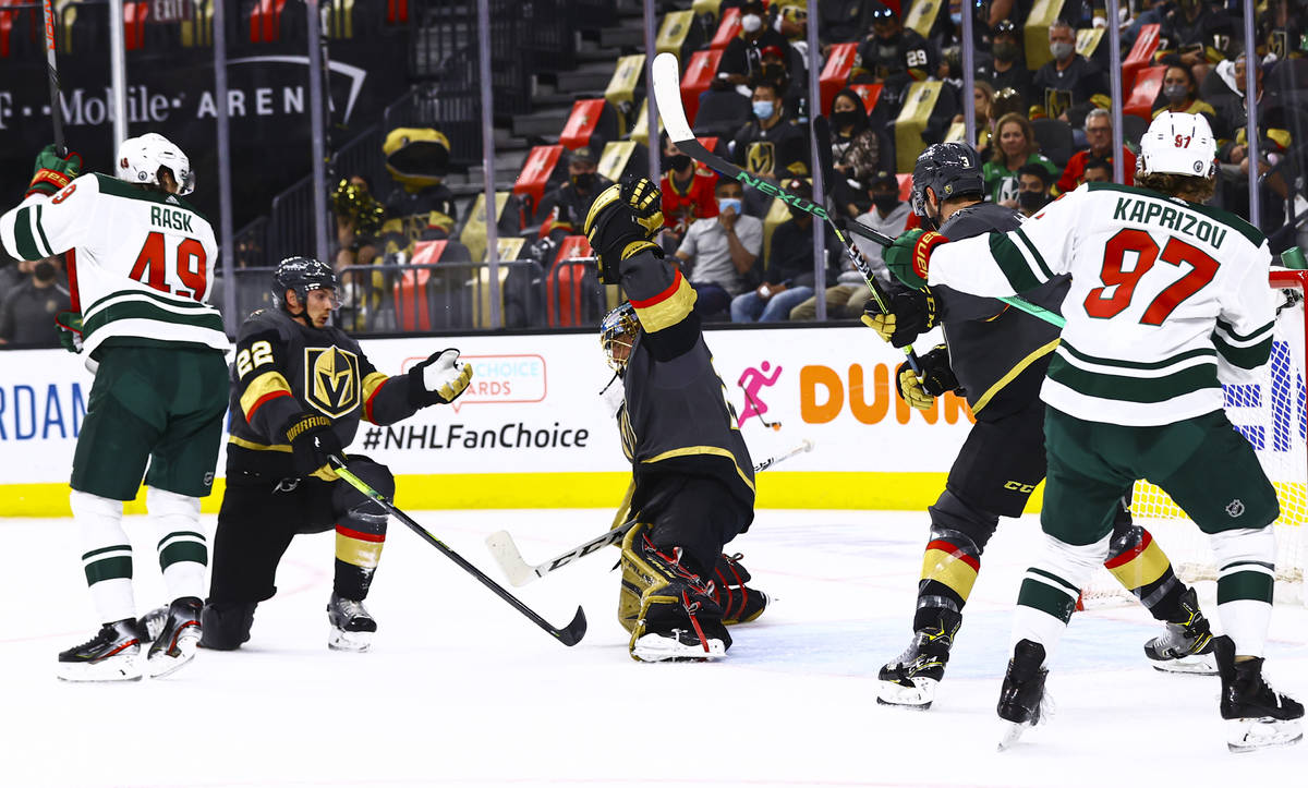 Golden Knights goaltender Marc-Andre Fleury (29) makes a glove save against Minnesota Wild in f ...