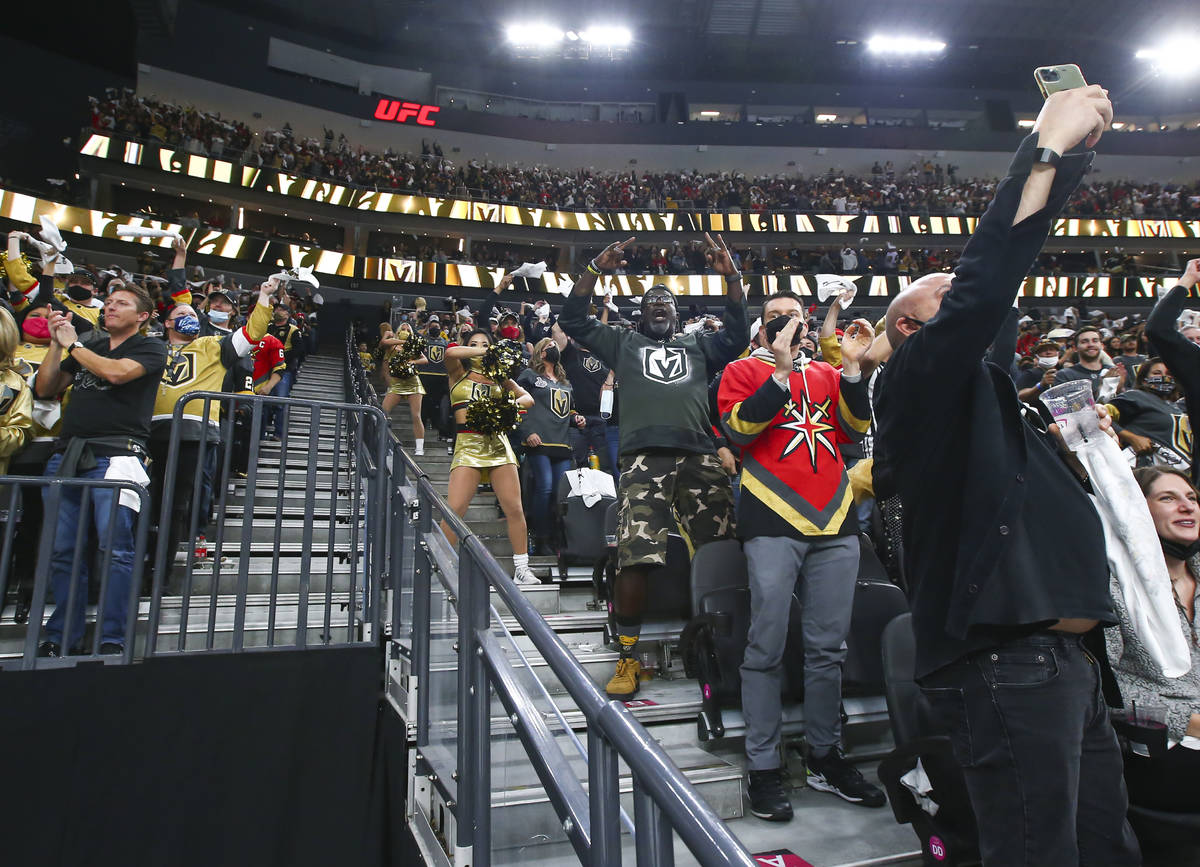 Golden Knights fans celebrate a goal by Alec Martinez, not pictured, against Minnesota Wild dur ...