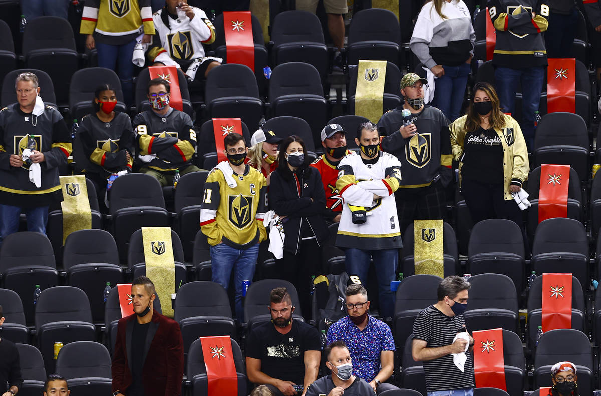 Golden Knights fans react in the last moments of the third period of Game 5 of a first-round NH ...