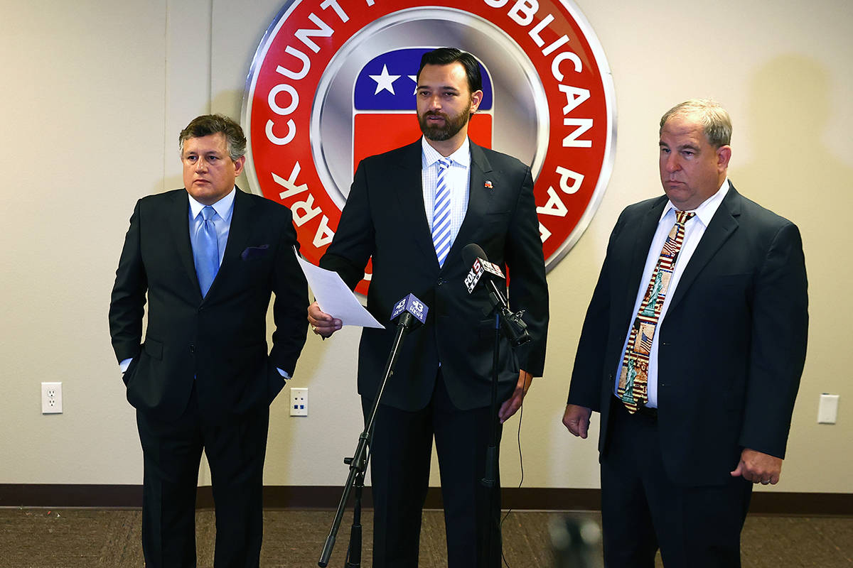 Clark County Republican Party Vice Chairman Stephen Silberkraus, center, speaks during a press ...