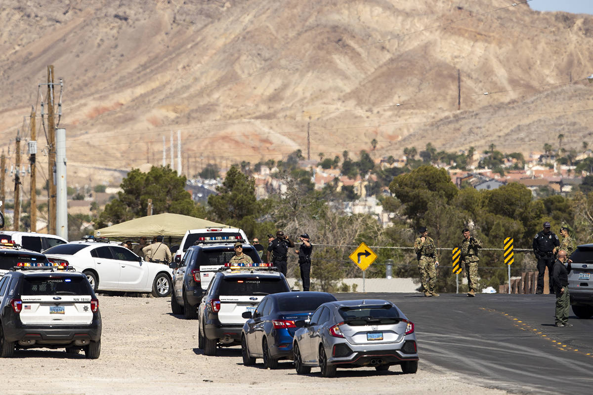 Metro officers and military personnel are staged for a Nellis Air Force Base jet crash on E. Ca ...