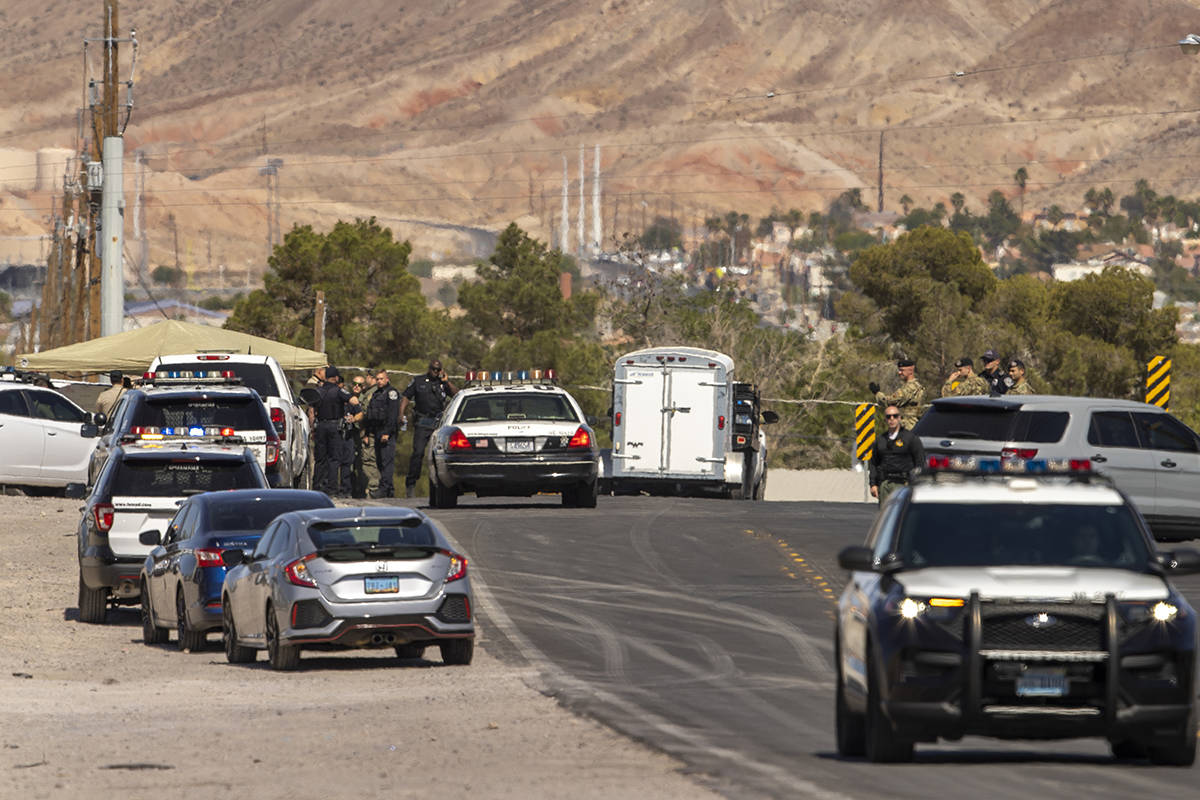 Metro officers and military personnel are staged for a Nellis Air Force Base jet crash on E. Ca ...