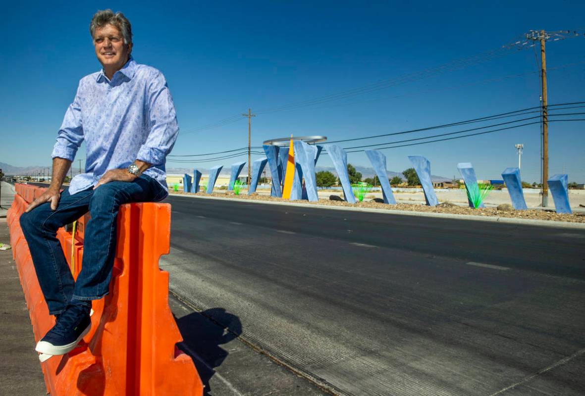 Robert Spencer Davidson sits near his new work during the dedication for "Absolute Ceiling," an ...