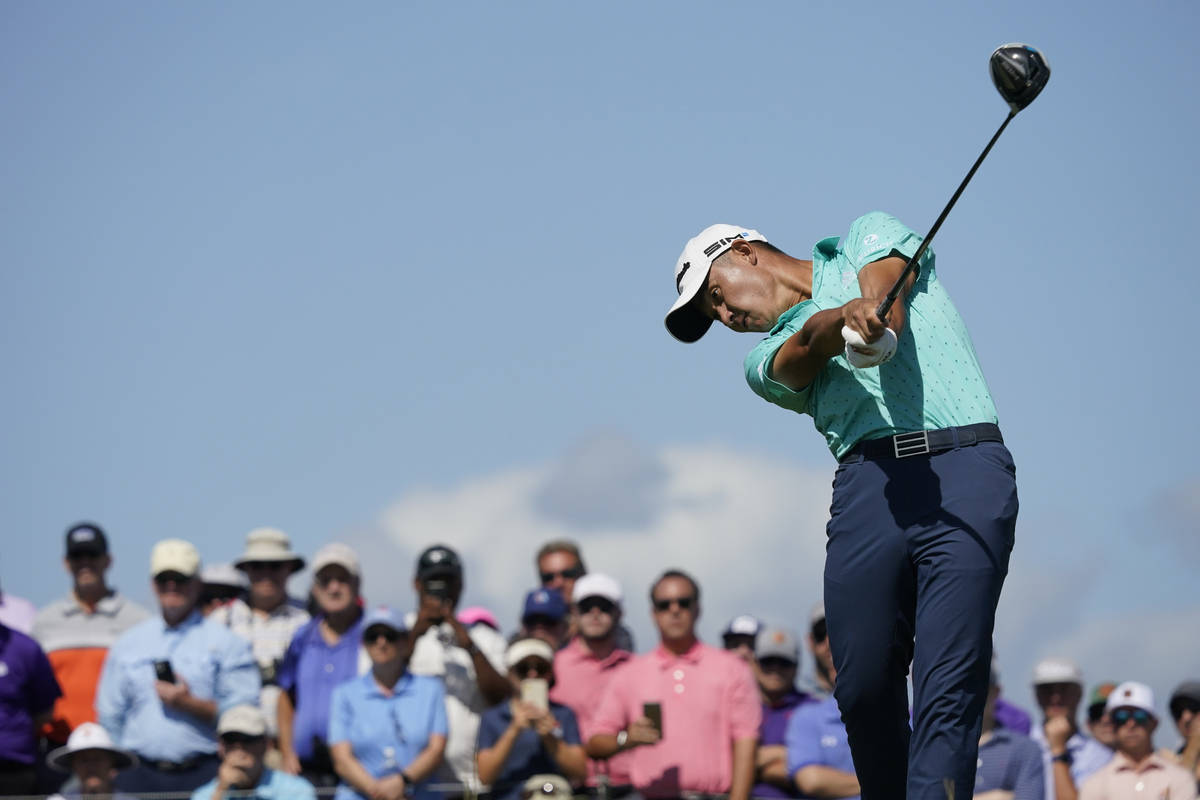 Collin Morikawa hits his tee shot on the 15th tee during the first round of the PGA Championshi ...