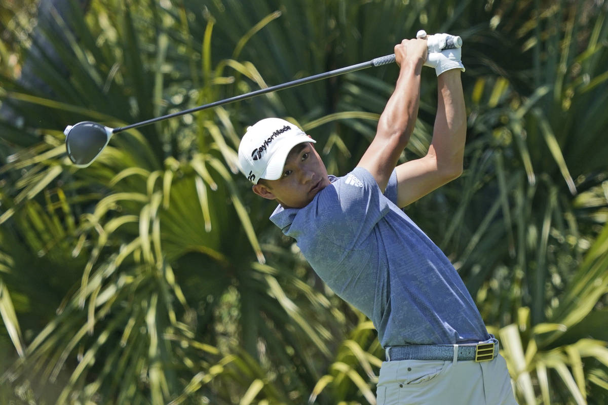 Collin Morikawa watches his tee shot on the second hole during the second round of the PGA Cham ...