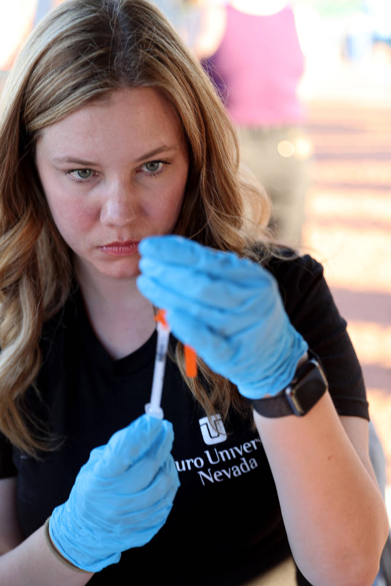 Touro University Physician Assistant student Calli Collins prepares COVID-19 vaccines at the We ...