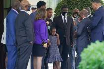 Members of the George Floyd family, including Floyd's daughter Gianna, center, talk outside the ...