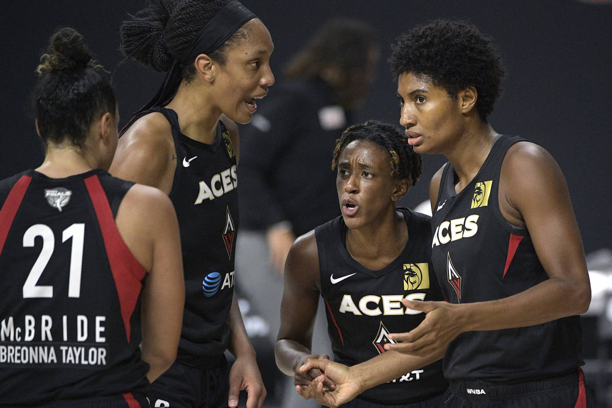 Las Vegas Aces guard Kayla McBride (21), center A'ja Wilson (22), guard Danielle Robinson, seco ...