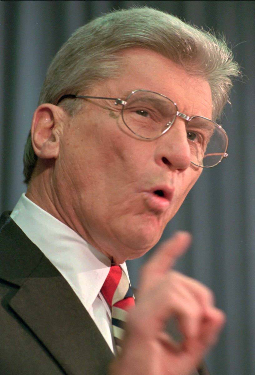 In this Feb. 22, 1996 file photo former U.S. Sen. John Warner, R-Va., speaks during a press con ...