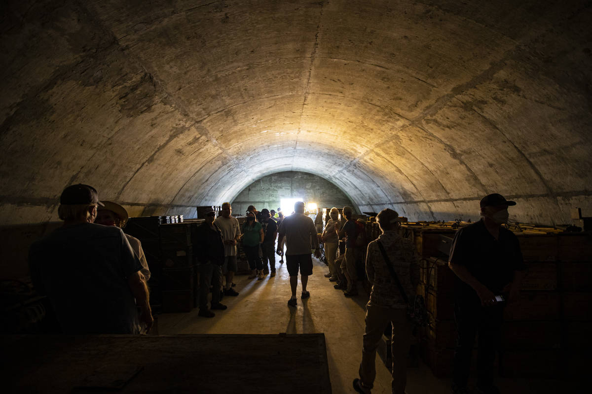 People walk through a munitions bunker during a tour of the Historic Wendover Airfield, a World ...