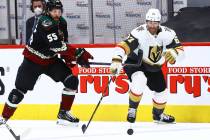 Golden Knights' Max Pacioretty (67) reaches out for the puck under pressure from Arizona Coyote ...