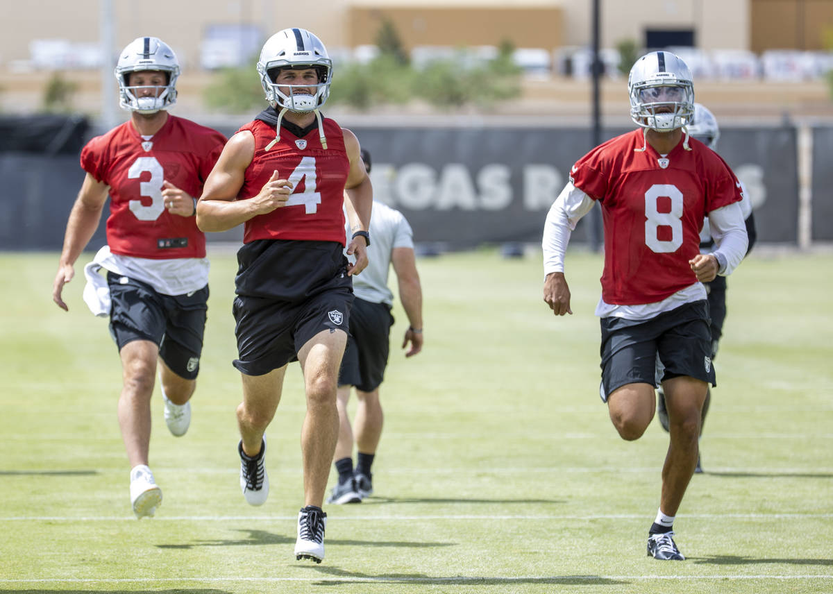 Quarterbacks Derek Carr (4), Nathan Peterman (3) and Marcus Mariota (8) sprint during a Las Veg ...