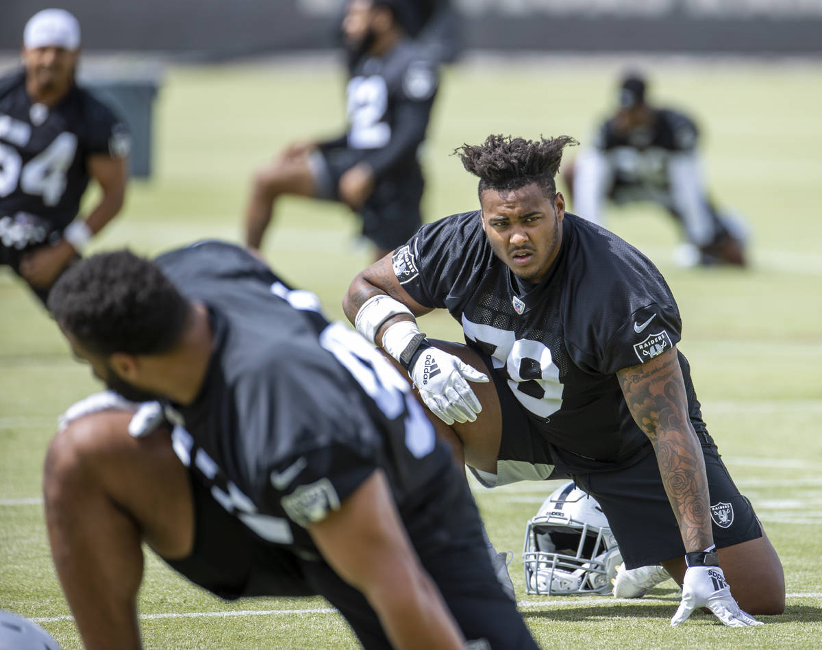 Defensive tackle Darius Stills (79) stretches during a Las Vegas Raiders open practice at the I ...