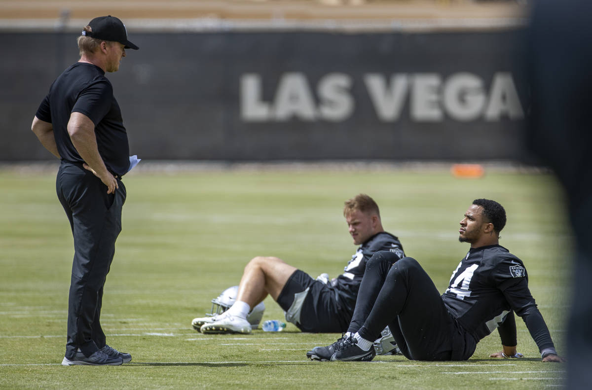 Head Coach Jon Gruden talks with safety Johnathan Abram (24) during a Las Vegas Raiders open pr ...