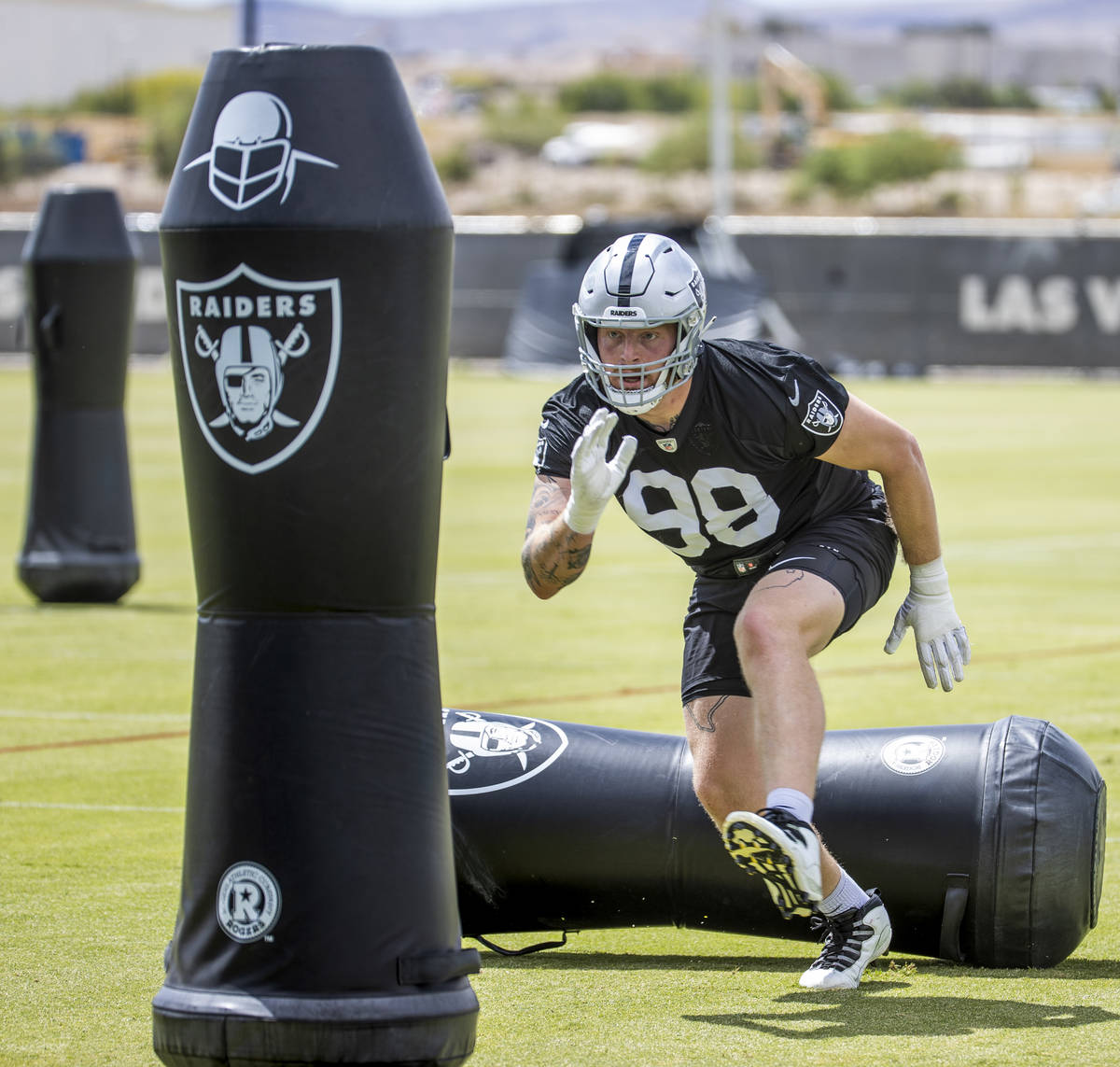 Defensive end Maxx Crosby (98) runs a drill during a Las Vegas Raiders open practice at the Int ...