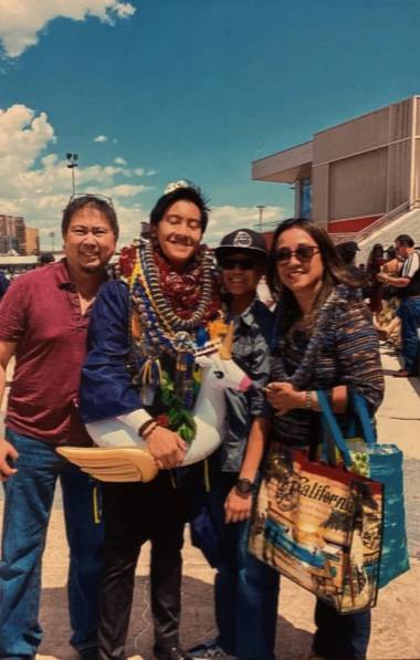 Filbert Aquino and family celebrate the graduation of his older son, Thomas, from high school i ...