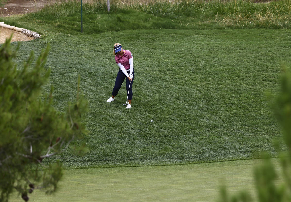 Brooke Henderson hits a chip shot at the 10th hole during the first round of the Bank of Hope L ...