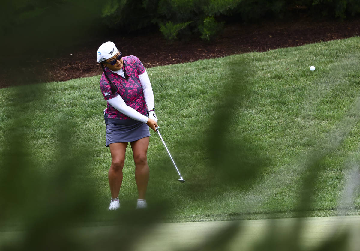 Christina Kim chips from the rough on the 12th hole during the first round of the Bank of Hope ...