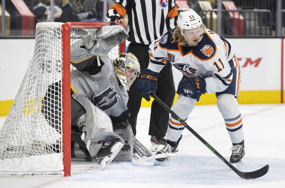 Henderson Silver Knights goaltender Logan Thompson (36) collides with Bakersfield Condors left ...