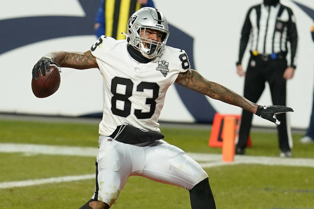 Las Vegas Raiders tight end Darren Waller (83) celebrates after scoring a 2-point conversion ag ...