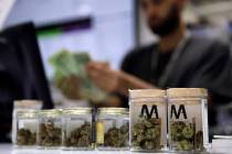 A cashier rings up a marijuana sale at the Essence cannabis dispensary in Las Vegas. (John Loch ...