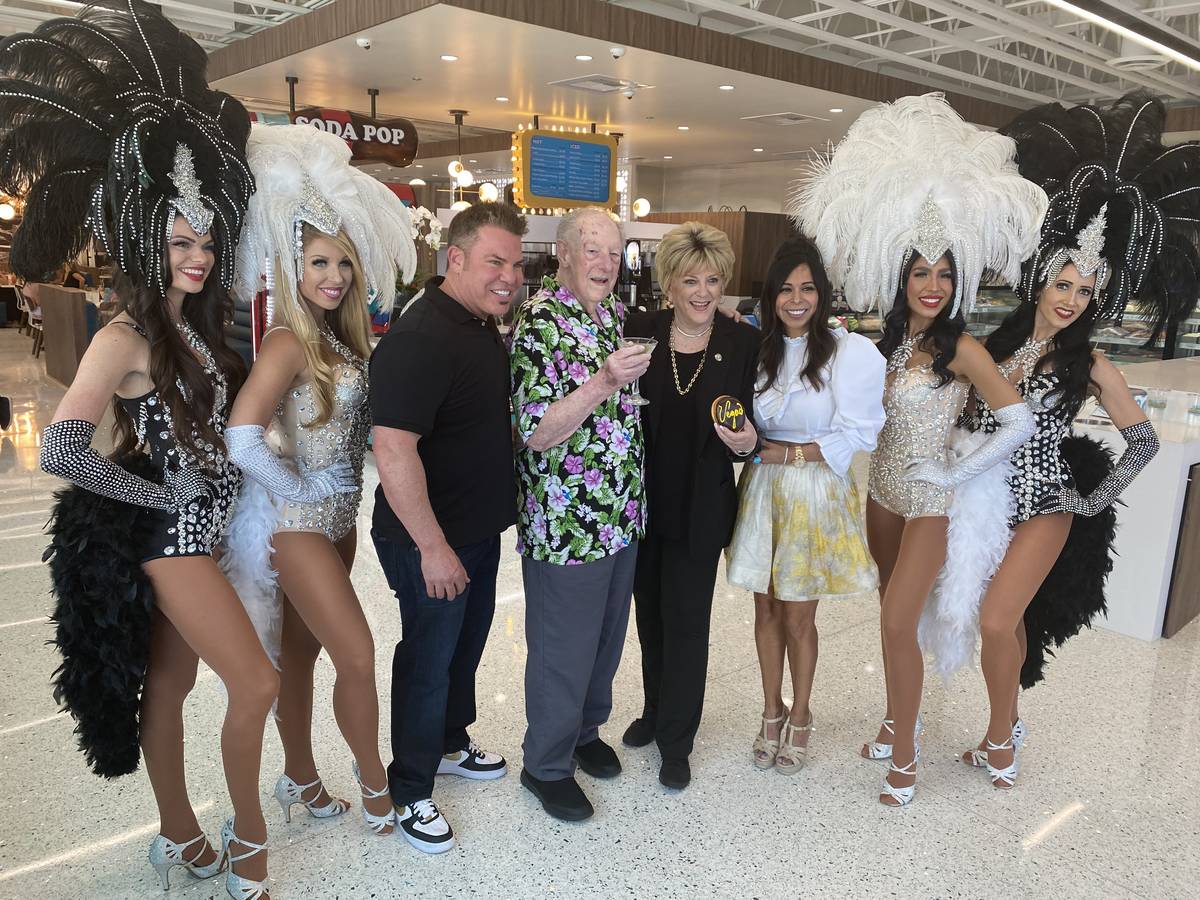 Steven and Judi Siegel are shown with Oscar and Carolyn Goodman, along with the ZB Showgirls, a ...
