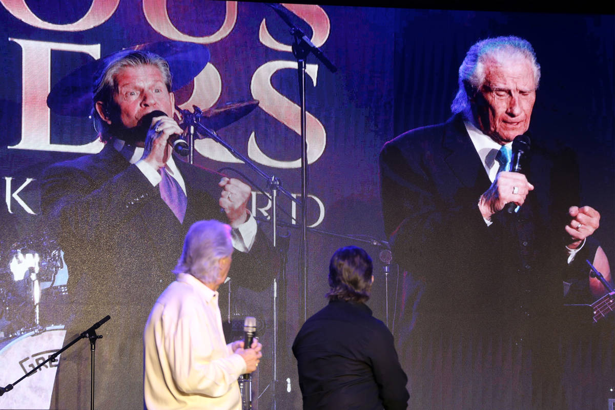 Bill Medley, left, and Bucky Heard of the Righteous Brothers watch a video of a past performanc ...
