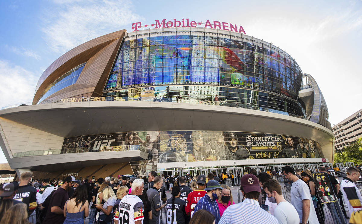 Fans wait to enter T-Mobile Arena before the start of Game 7 of an NHL Stanley Cup first-round ...
