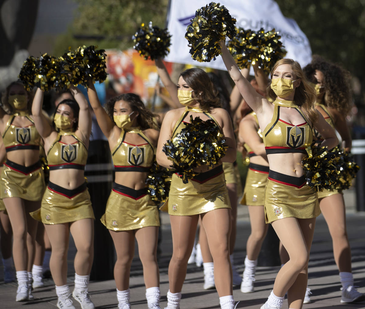 The Golden Aces cheerleaders fire up the crowd outside T-Mobile Arena before the start of Game ...